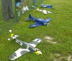 A line-up planes including Norm's and Jay's 109s, Jay's Dauntless, and Earl's Corsair