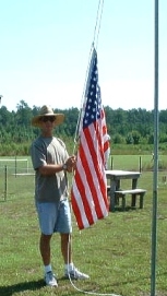 Rocks' raising the flag during Founder's Day setup - Atkinson photo